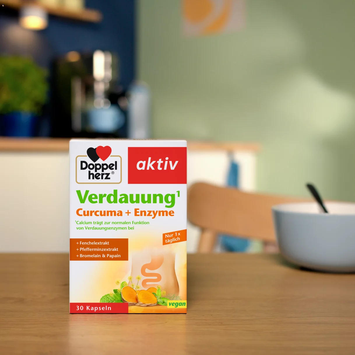 Doppelherz Verdauung Curcuma + Enzyme auf Esstisch